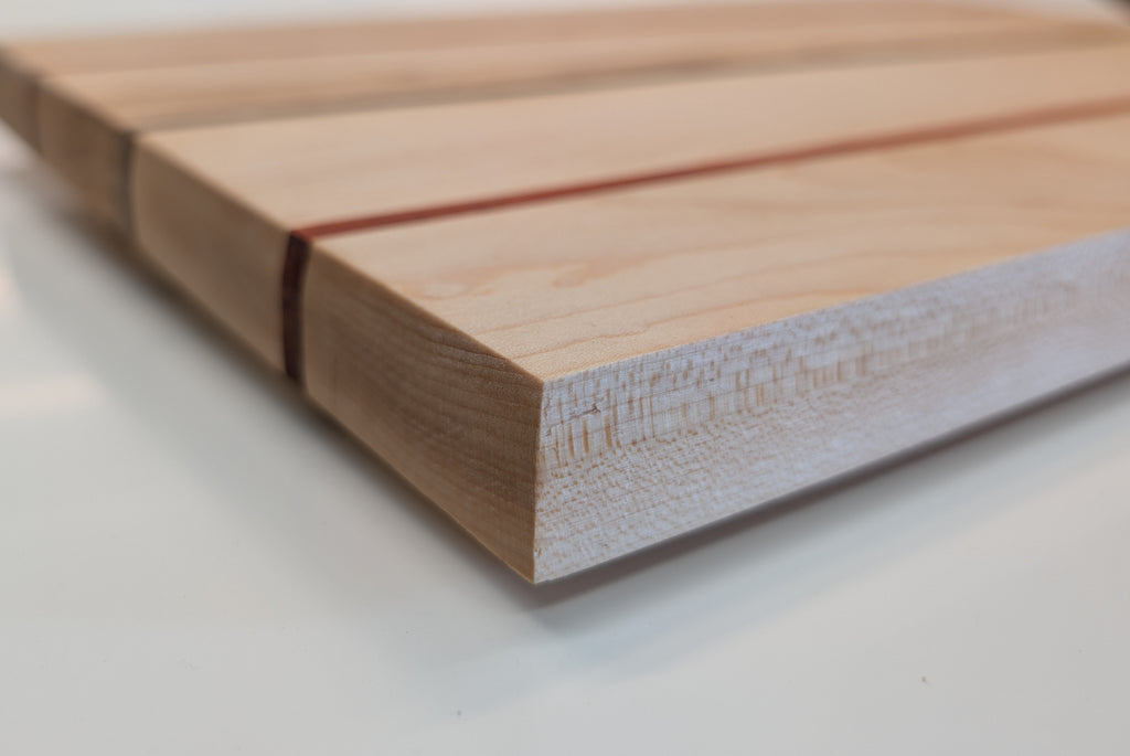 The Triad. Maple Serving board with Padauk and walnut inlay.